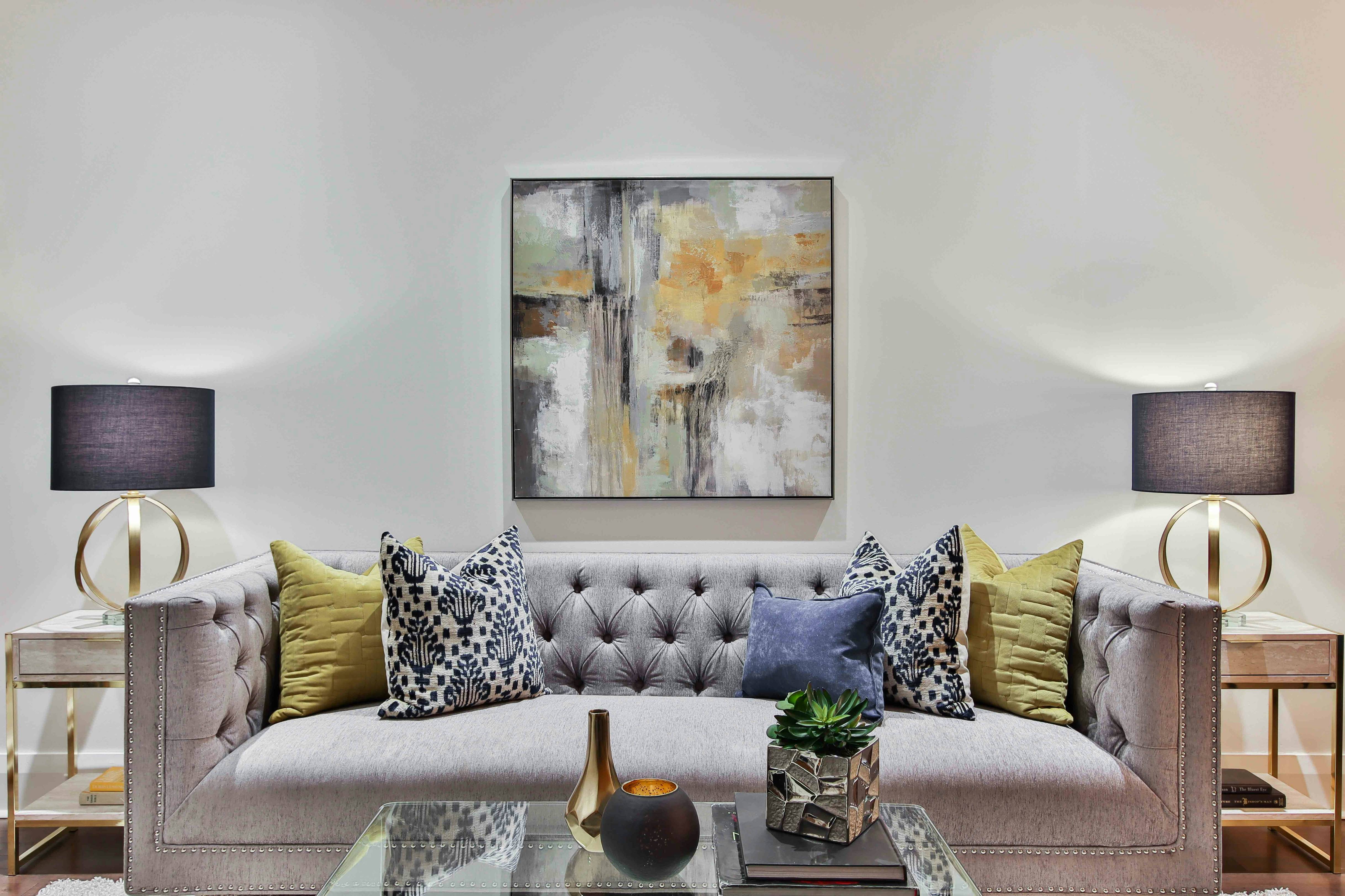 white and blue floral throw pillows on white couch