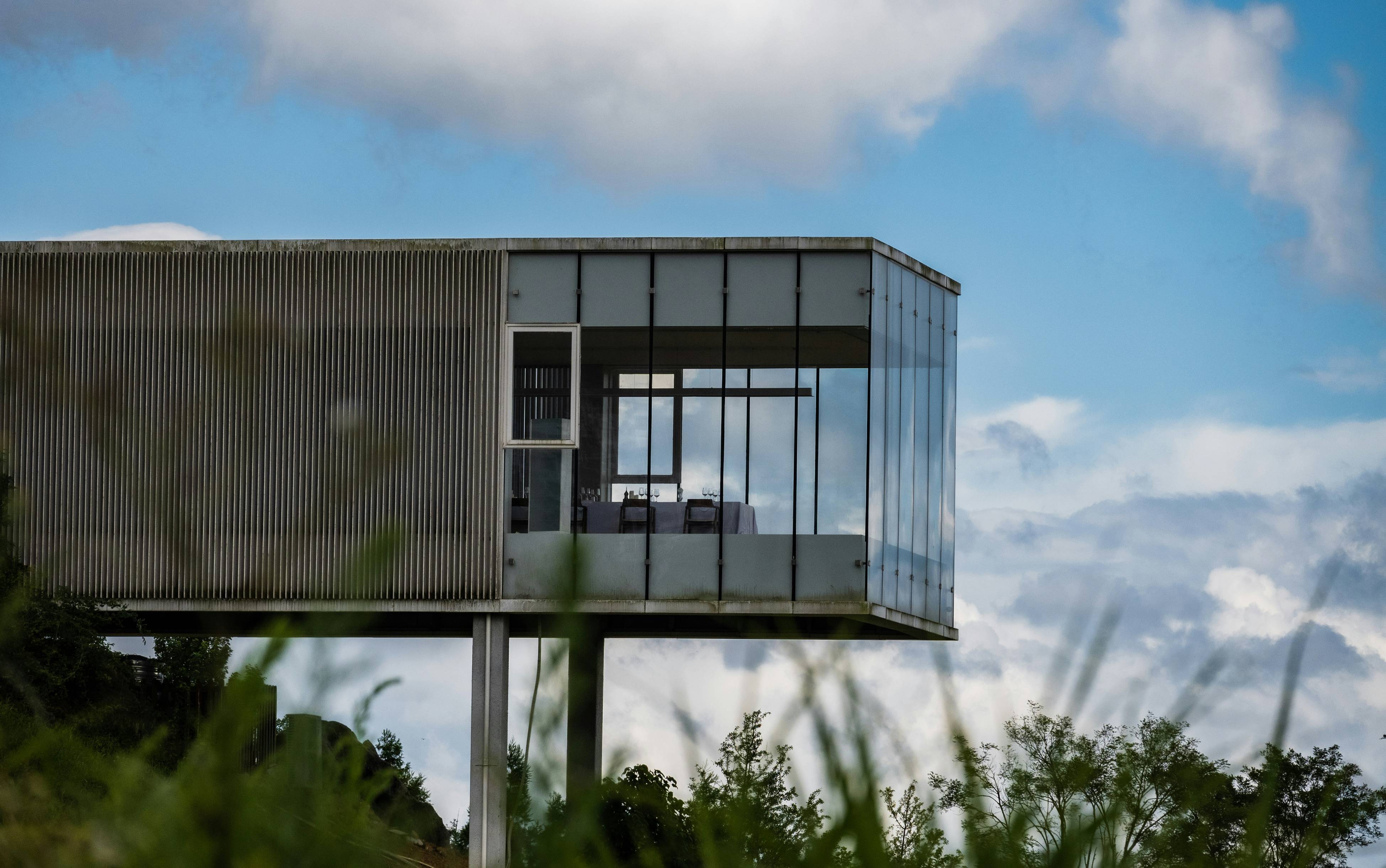 A tall tower with a car on top of it